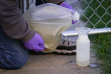 Monitoring wastewater can potentially stop coronavirus outbreaks before they get out of hand. Here, sewage samples are collected from the dorms at Utah State University. (AP Photo/Rick Bowmer)