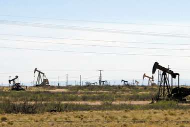 Oil rigs stand in the Loco Hills field near Artesia, New Mexico, one of the most active regions of the Permian Basin. (AP Photo/Jeri Clausing)
