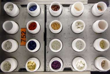 Various prescription drugs are seen on an automated pharmacy assembly line. A new deep-learning system may be able to tell doctors how a patient will respond to different medications. (AP Photo/Matt Rourke)
