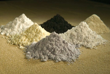 Lanthanide oxides: clockwise from top center: praseodymium, cerium, lanthanum, neodymium, samarium and gadolinium. (US Department of Agriculture/Peggy Greb)