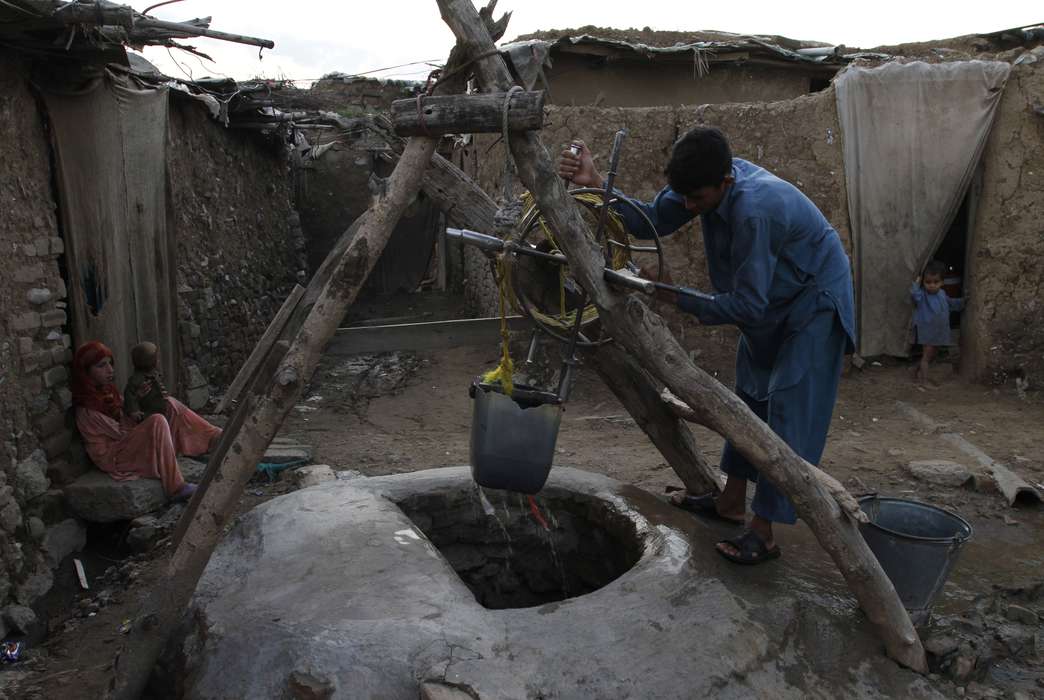 Dropping global water levels could leave 20% of all wells dry. (AP Photo/K.M. Chaudary